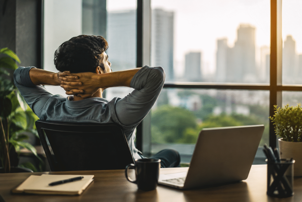 An employee taking a mental reset by looking out the window